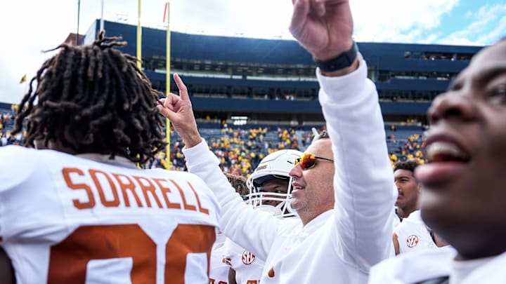 Sep 7, 2024; Ann Arbor, Michigan, USA; Texas head coach Steve Sarkisian and Texas players celebrate their win over Michigan at Michigan Stadium. Mandatory Credit: Junfu Han-USA TODAY Network via Imagn Images