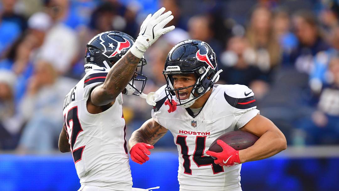 Dec 27, 2025; Inglewood, California, USA;  Houston Texans wide receiver Jaylin Noel (14) reacts with wide receiver Nico Collins (12) after catching a touchdown against the Los Angeles Chargers during the first half at SoFi Stadium. Mandatory Credit: Gary A. Vasquez-Imagn Images