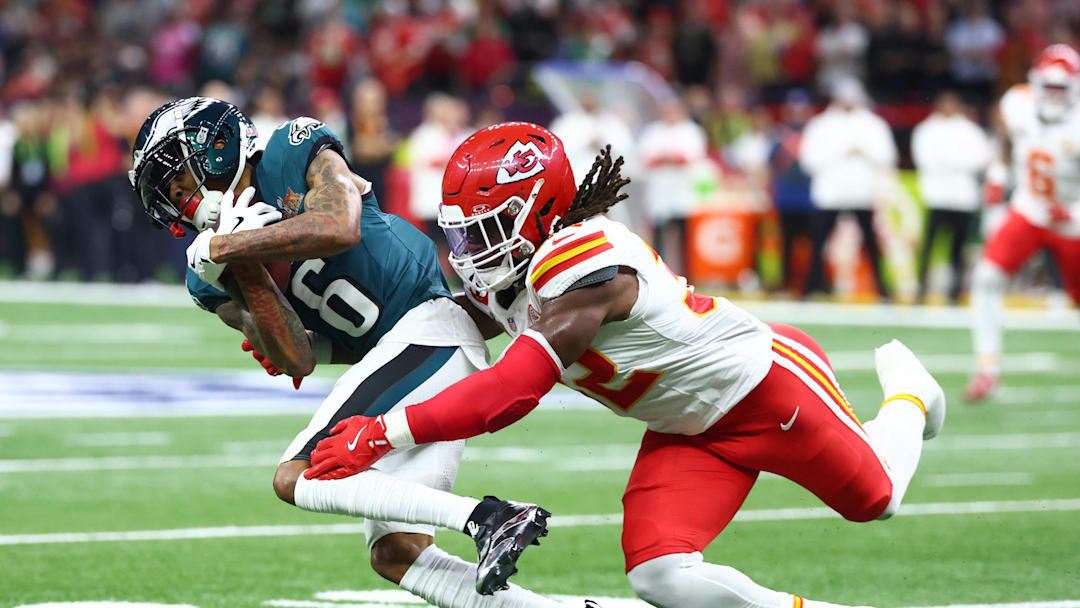 Feb 9, 2025; New Orleans, LA, USA; Philadelphia Eagles wide receiver DeVonta Smith (6) makes a catch against Kansas City Chiefs linebacker Nick Bolton (32) in the first quarter in Super Bowl LIX at Ceasars Superdome. Mandatory Credit: Mark J. Rebilas-Imagn Images
