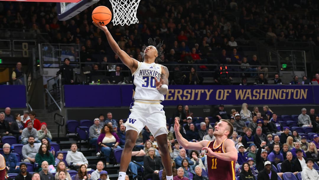 Feb 14, 2026; Seattle, Washington, USA; Washington Huskies guard Courtland Muldrew (30) shoots the ball against the Minnesota Golden Gophers during the first half at Alaska Airlines Arena at Hec Edmundson Pavilion. Mandatory Credit: Steven Bisig-Imagn Images