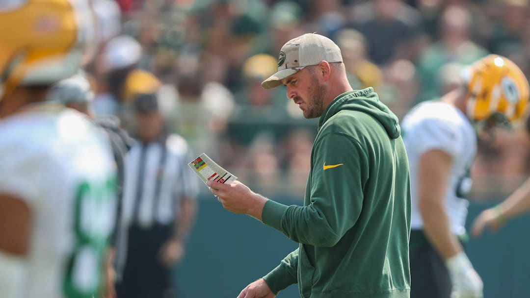 Green Bay Packers quarterbacks coach Sean Mannion reviews his practice schedule during practice on Friday, August 1, 2025, at Ray Nitschke Field in Ashwaubenon, Wis. 