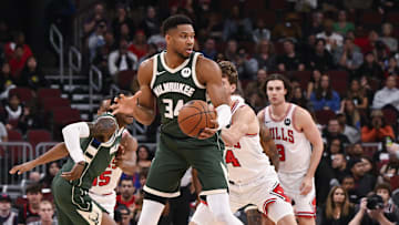 Oct 12, 2025; Chicago, Illinois, USA;  Milwaukee Bucks forward Giannis Antetokounmpo (34) grabs the ball against the Chicago Bulls during the first half at the United Center. Mandatory Credit: Matt Marton-Imagn Images