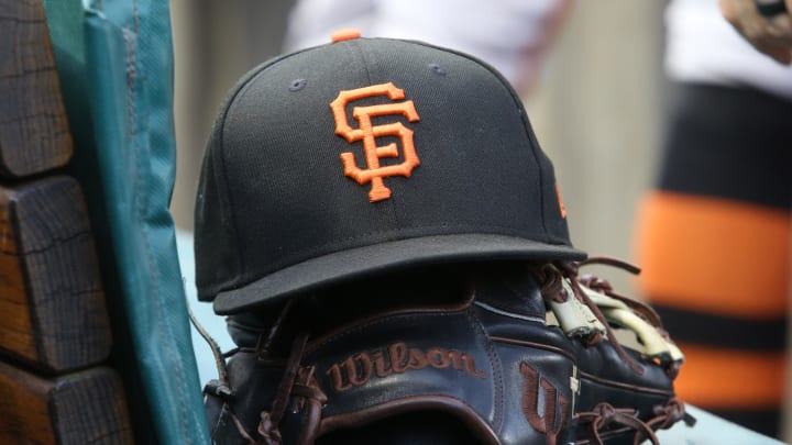 Jul 14, 2023; Pittsburgh, Pennsylvania, USA;  San Francisco Giants hat and glove on the bench against the Pittsburgh Pirates during the first inning at PNC Park. Mandatory Credit: Charles LeClaire-USA TODAY Sports