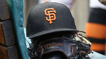 Jul 14, 2023; Pittsburgh, Pennsylvania, USA;  San Francisco Giants hat and glove on the bench against the Pittsburgh Pirates during the first inning at PNC Park.