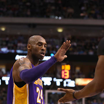 Los Angeles Lakers guard Kobe Bryant (24) celebrates with center Dwight Howard (12) in the second half against the Dallas Mavericks at the American Airlines Center.