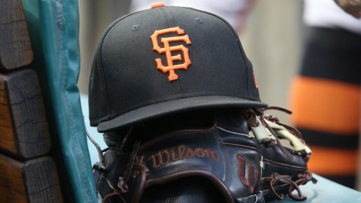 Jul 14, 2023; Pittsburgh, Pennsylvania, USA;  San Francisco Giants hat and glove on the bench against the Pittsburgh Pirates during the first inning at PNC Park.