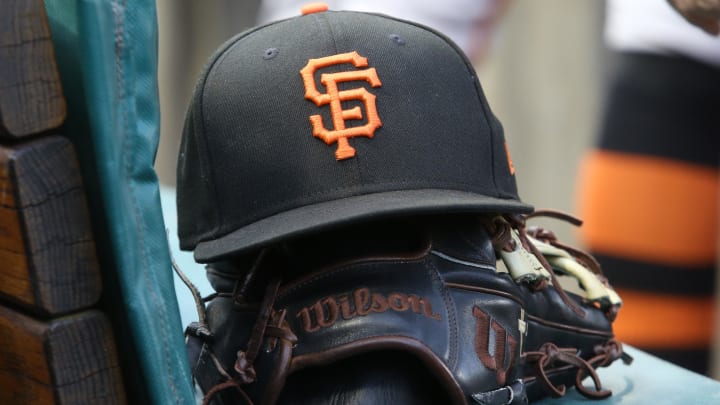Jul 14, 2023; Pittsburgh, Pennsylvania, USA;  San Francisco Giants hat and glove on the bench against the Pittsburgh Pirates during the first inning at PNC Park.