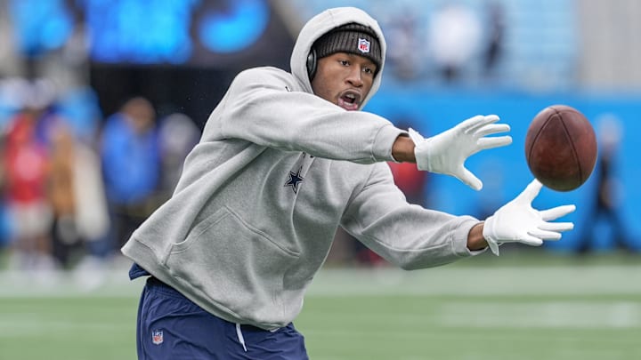 Dallas Cowboys safety Israel Mukuamu makes a catch during pregame warmups against the Carolina Panthers at Bank of America Stadium.