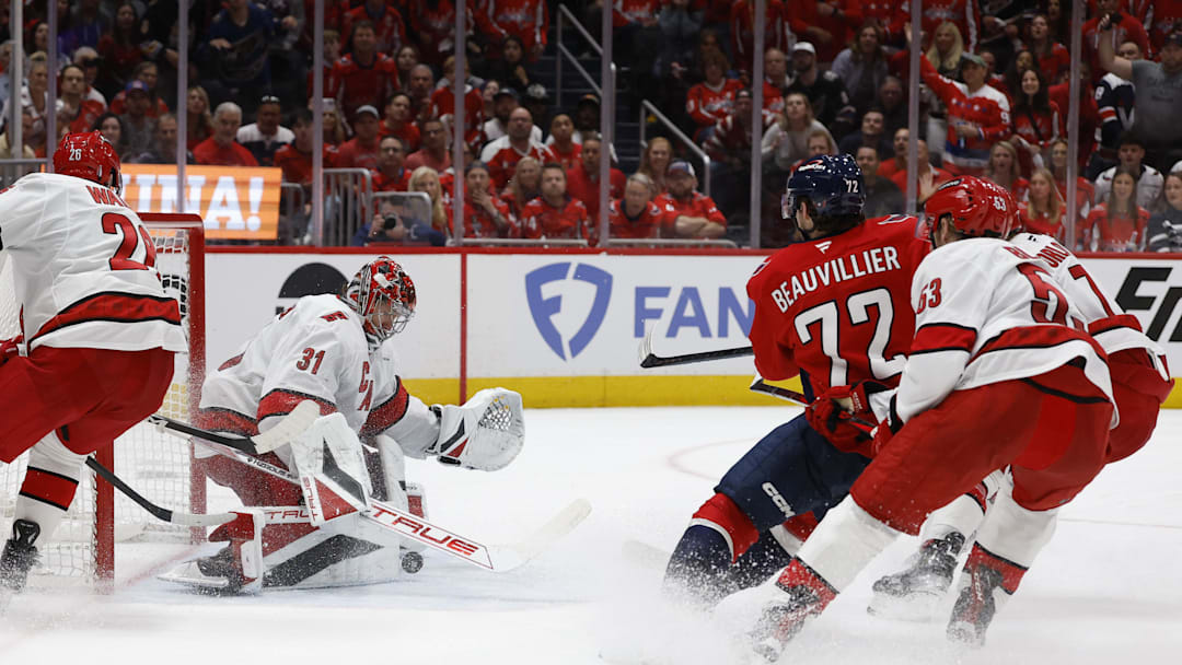 May 15, 2025; Washington, District of Columbia, USA; Carolina Hurricanes goaltender Frederik Andersen (31) makes a save on Washington Capitals left wing Anthony Beauvillier (72) in the third period in game five of the second round of the 2025 Stanley Cup Playoffs at Capital One Arena. Mandatory Credit: Geoff Burke-Imagn Images