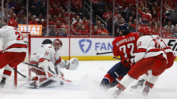 May 15, 2025; Washington, District of Columbia, USA; Carolina Hurricanes goaltender Frederik Andersen (31) makes a save on Washington Capitals left wing Anthony Beauvillier (72) in the third period in game five of the second round of the 2025 Stanley Cup Playoffs at Capital One Arena. Mandatory Credit: Geoff Burke-Imagn Images