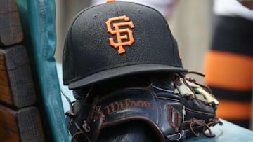 Jul 14, 2023; Pittsburgh, Pennsylvania, USA;  San Francisco Giants hat and glove on the bench against the Pittsburgh Pirates during the first inning at PNC Park.