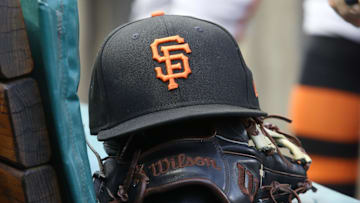 Jul 14, 2023; Pittsburgh, Pennsylvania, USA;  San Francisco Giants hat and glove on the bench against the Pittsburgh Pirates during the first inning at PNC Park.