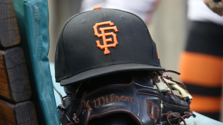 Jul 14, 2023; Pittsburgh, Pennsylvania, USA;  San Francisco Giants hat and glove on the bench against the Pittsburgh Pirates during the first inning at PNC Park. Mandatory Credit: Charles LeClaire-USA TODAY Sports