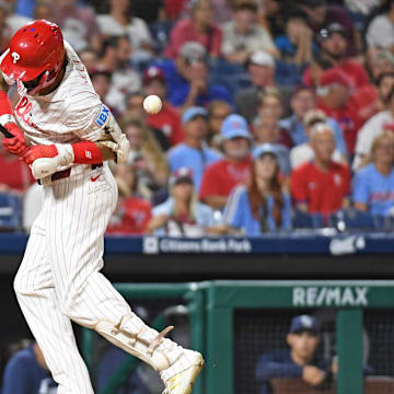 Sep 10, 2024; Philadelphia, Pennsylvania, USA; Philadelphia Phillies outfielder Nick Castellanos (8) gets hit by a pitch during the eighth inning against the Tampa Bay Rays at Citizens Bank Park. 