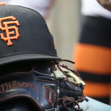 Jul 14, 2023; Pittsburgh, Pennsylvania, USA;  San Francisco Giants hat and glove on the bench against the Pittsburgh Pirates during the first inning at PNC Park.