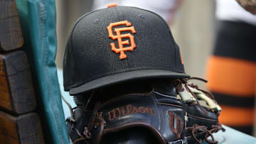 Jul 14, 2023; Pittsburgh, Pennsylvania, USA;  San Francisco Giants hat and glove on the bench against the Pittsburgh Pirates during the first inning at PNC Park.