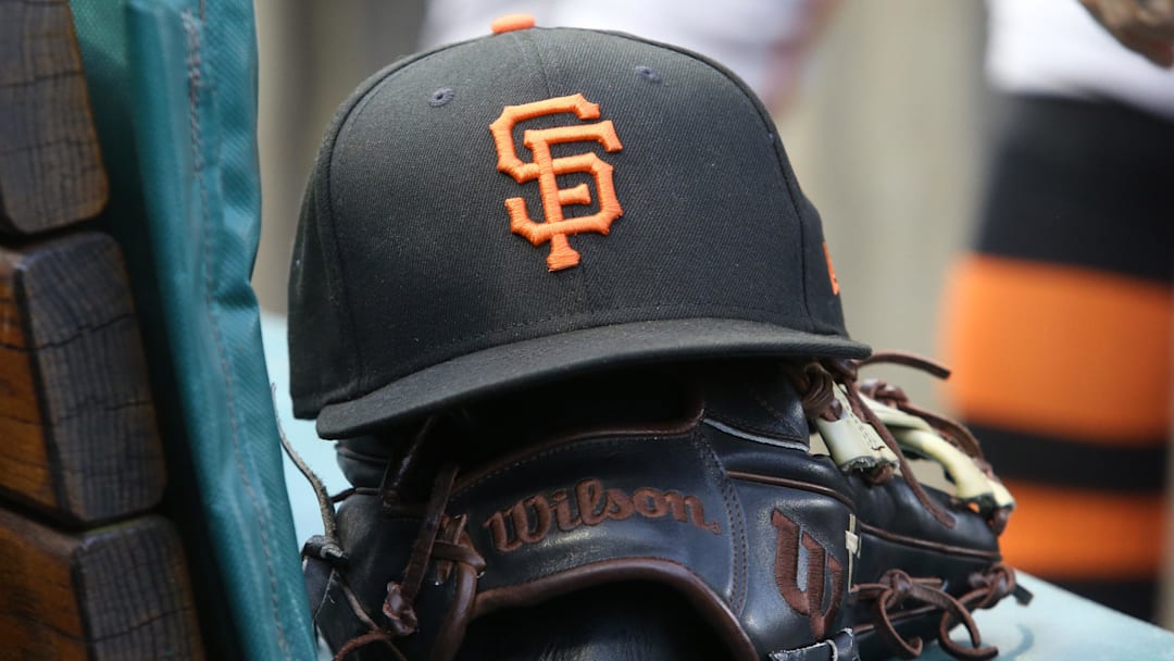 Jul 14, 2023; Pittsburgh, Pennsylvania, USA; San Francisco Giants hat and glove on the bench against the Pittsburgh Pirates during the first inning at PNC Park. Jul 14, 2023; Pittsburgh, Pennsylvania, USA; San Francisco Giants hat and glove on the bench against the Pittsburgh Pirates during the first inning at PNC Park.