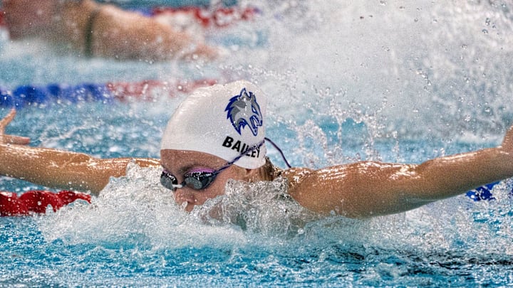 Waukee Northwest's Hayden Bailey swims the 100-yard butterfly race during the Iowa high school girls state swim meet at Marshalltown YMCA on Saturday, Nov. 16, 2024, in Marshalltown. Waukee Northwest's Hayden Bailey swims the 100-yard butterfly race during the Iowa high school girls state swim meet at Marshalltown YMCA on Saturday, Nov. 16, 2024, in Marshalltown.