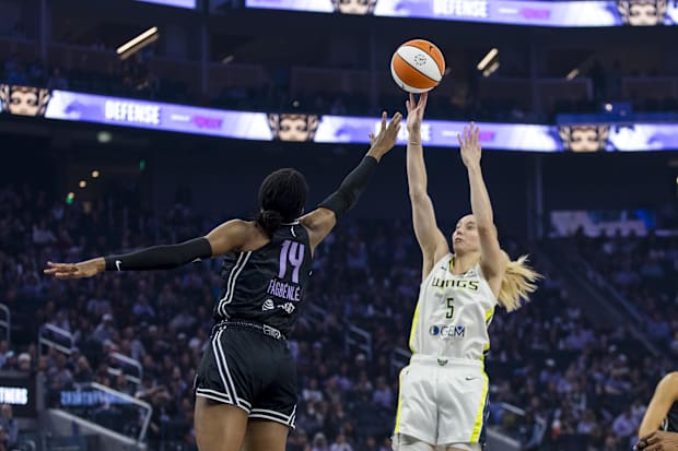 Dallas Wings guard Paige Bueckers and Golden State Valkyries center Temi Fagbenle