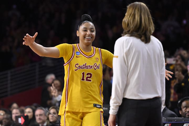 USC Trojans guard JuJu Watkins hugs head coach Lindsay Gottlieb during the NCAA Tournament. 