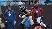 Nov 30, 2025; Charlotte, North Carolina, USA; Carolina Panthers wide receiver Tetairoa McMillan (4) runs after making a catch during the fourth quarter against the Los Angeles Rams at Bank of America Stadium. Mandatory Credit: Scott Kinser-Imagn Images
