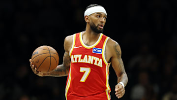 Hawks guard Nickeil Alexander-Walker (7) dribbles the ball up the court in a game against the Brooklyn Nets. 