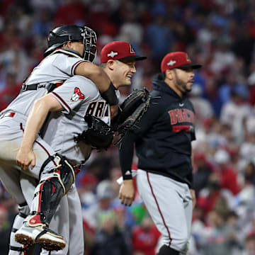 Oct 24, 2023; Philadelphia, Pennsylvania, USA; Arizona Diamondbacks relief pitcher Paul Sewald (38) reacts with  catcher Gabriel Moreno (14) after defeating the Philadelphia Phillies in game seven of the NLCS for the 2023 MLB playoffs at Citizens Bank Park. Mandatory Credit: Bill Streicher-Imagn Images