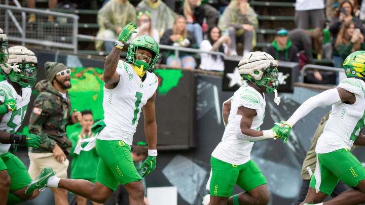 Oregon White Team wide receiver Traeshon Holden waves to the crowd as the team takes the field during the Oregon Ducks’ Spring Game Saturday, April 27. 2024 at Autzen Stadium in Eugene, Ore.