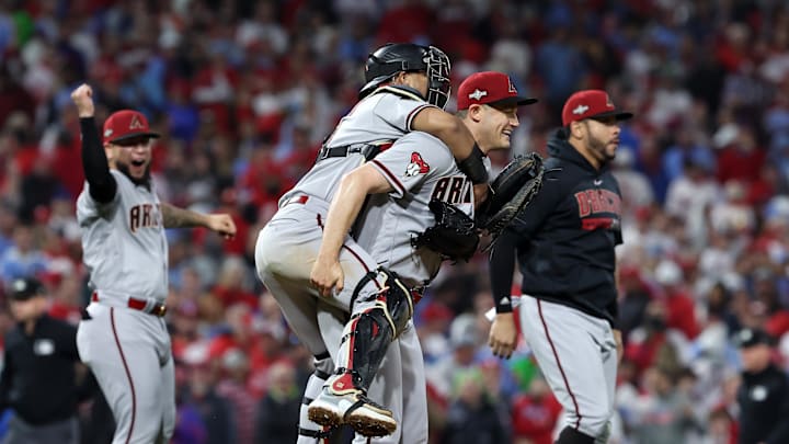 Oct 24, 2023; Philadelphia, Pennsylvania, USA; Arizona Diamondbacks relief pitcher Paul Sewald (38) reacts with  catcher Gabriel Moreno (14) after defeating the Philadelphia Phillies in game seven of the NLCS for the 2023 MLB playoffs at Citizens Bank Park. Mandatory Credit: Bill Streicher-Imagn Images