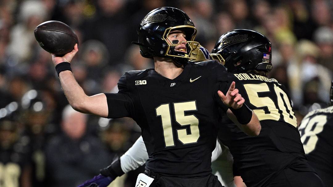 Purdue Boilermakers quarterback Ryan Browne (15) throws a pass. Purdue Boilermakers quarterback Ryan Browne (15) throws a pass.