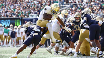 Oct 26, 2024; East Rutherford, New Jersey, USA;  Notre Dame Fighting Irish running back Jeremiyah Love (4) rushes for a touchdown during the first half against the Notre Dame Fighting Irish at MetLife Stadium. Mandatory Credit: Vincent Carchietta-Imagn Images