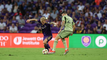 Jun 15, 2024; Orlando, Florida, USA; Orlando City midfielder Dagur Thorhallsson (17) controls the ball from LAFC defender Ryan Hollingshead (24) in the first half at Inter&Co Stadium. Mandatory Credit: Nathan Ray Seebeck-USA TODAY Sports