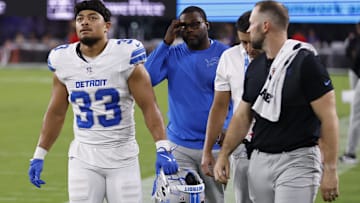 Sep 22, 2025; Baltimore, Maryland, USA; Detroit Lions running back Sione Vaki (33) is helped to the locker room during the first half at M&T Bank Stadium. 