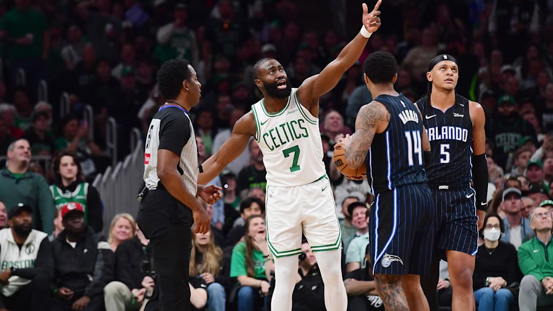 Apr 20, 2025; Boston, Massachusetts, USA; Boston Celtics guard Jaylen Brown (7) questions a foul to referee Mitchell Ervin during the second half against the Orlando Magic at TD Garden. Mandatory Credit: Bob DeChiara-Imagn Images