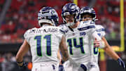 Dec 7, 2025; Atlanta, Georgia, USA; Seattle Seahawks wide receiver Jaxon Smith-Njigba (11) and quarterback Sam Darnold (14) celebrate after a touchdown against the Atlanta Falcons in the fourth quarter at Mercedes-Benz Stadium. Mandatory Credit: Brett Davis-Imagn Images