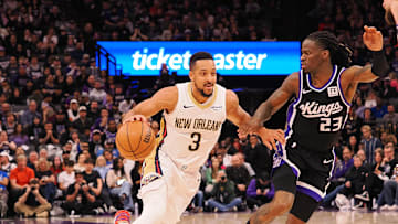 Feb 8, 2025; Sacramento, California, USA; New Orleans Pelicans guard CJ McCollum (3) drives in against Sacramento Kings guard Keon Ellis (23) during the fourth quarter at Golden 1 Center. Mandatory Credit: Kelley L Cox-Imagn Images