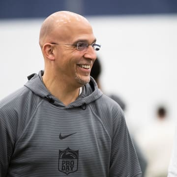 Penn State coach James Franklin talks with a few players at the program's Pro Day in Holuba Hall. 