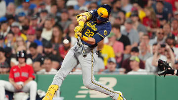 May 24, 2024; Boston, Massachusetts, USA; Milwaukee Brewers designated hitter Christian Yelich (22) hits an RBI double against the Boston Red Sox during the fifth inning at Fenway Park. Mandatory Credit: Gregory Fisher-USA TODAY Sports
