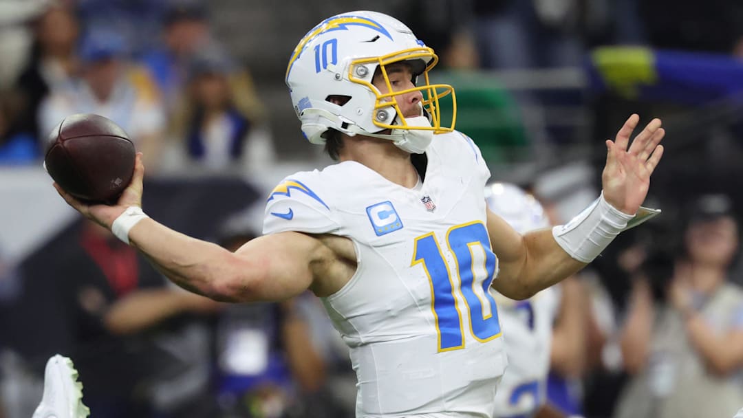 Jan 11, 2025; Houston, Texas, USA; Los Angeles Chargers quarterback Justin Herbert (10) looks to pass during the second quarter against the Houston Texans in an AFC wild card game at NRG Stadium. Mandatory Credit: Troy Taormina-Imagn Images