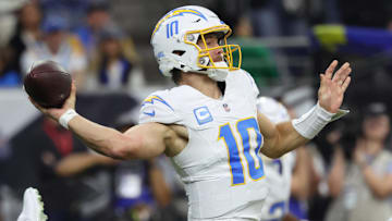 Jan 11, 2025; Houston, Texas, USA; Los Angeles Chargers quarterback Justin Herbert (10) looks to pass during the second quarter against the Houston Texans in an AFC wild card game at NRG Stadium. Mandatory Credit: Troy Taormina-Imagn Images