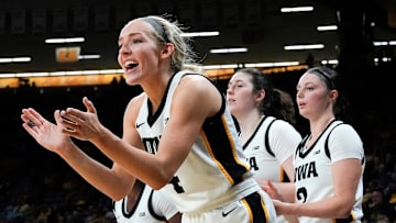 Iowa guard Kylie Feuerbach (4) cheers on her teammates Nov. 3, 2025 during a women’s college basketball game against the Southern Jaguars at Carver-Hawkeye Arena in Iowa City, Iowa.