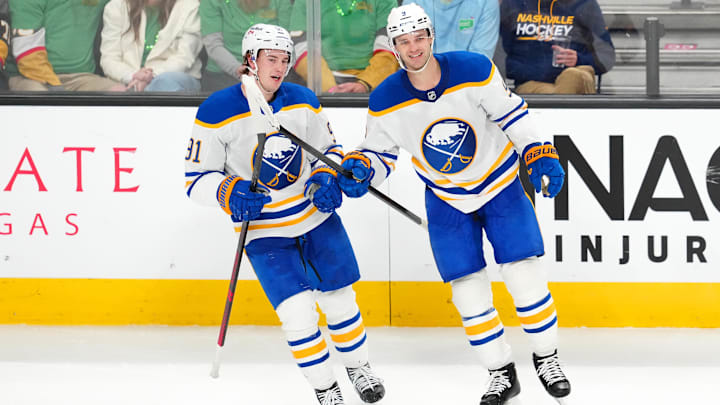 Mar 17, 2026; Las Vegas, Nevada, USA; Buffalo Sabres center Josh Norris (9) celebrates with right wing Josh Doan (91) after scoring an empty net goal against the Vegas Golden Knights near the end of the third period at T-Mobile Arena. Mandatory Credit: Stephen R. Sylvanie-Imagn Images