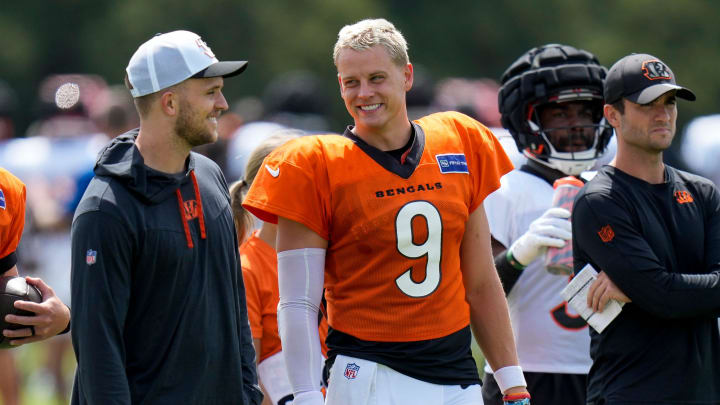 Cincinnati Bengals quarterback Joe Burrow (9) talks with quarterback Jake Browning during a preseason joint practice at the Paycor Stadium practice facility in downtown Cincinnati on Tuesday, Aug. 20, 2024.