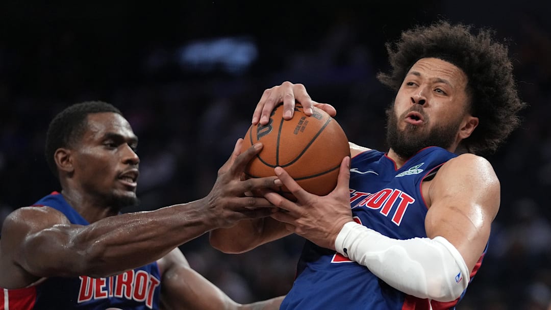 Jan 30, 2026; San Francisco, California, USA; Detroit Pistons guard Cade Cunningham (2) holds onto a rebound next to center Jalen Duren (0) against the Golden State Warriors in the fourth quarter at the Chase Center. Mandatory Credit: Cary Edmondson-Imagn Images