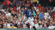 Seattle Mariners third baseman Dylan Moore (25) hits an RBI double against the Boston Red Sox during the fifth inning at Fenway Park on July 30.