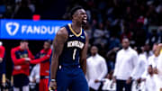 Jan 17, 2025; New Orleans, Louisiana, USA; New Orleans Pelicans forward Zion Williamson (1) reacts to dunking the ball through the arm of Utah Jazz forward Drew Eubanks (15) during the second half at Smoothie King Center. Mandatory Credit: Stephen Lew-Imagn Images
