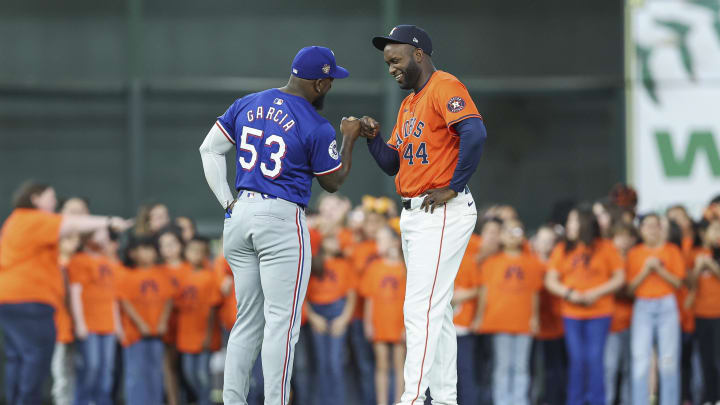 Apr 12, 2024; Houston, Texas, USA; Texas Rangers right fielder Adolis Garcia (53) greets Houston Astros designated hitter Yordan Alvarez (44) before the game at Minute Maid Park. Mandatory Credit: Troy Taormina-USA TODAY Sports