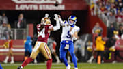 Dec 12, 2024; Santa Clara, California, USA; Los Angeles Rams quarterback Matthew Stafford (9) throws a pass over San Francisco 49ers linebacker Fred Warner (54) in the third quarter at Levi's Stadium. Mandatory Credit: Cary Edmondson-Imagn Images