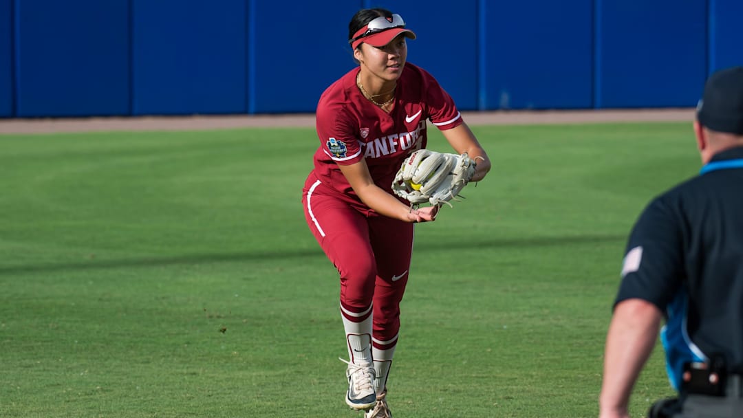 May 30, 2024; Oklahoma City, OK, USA; Stanford Cardinals outfielder Kyra Chan (8) makes an out in the first inning agains the Texas Longhorns during a Women's College World Series softball game at Devon Park. Mandatory Credit: Brett Rojo-Imagn Images