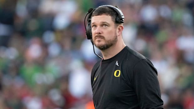 Oregon Ducks coach Dan Lanning looks to the clock towards the end of the first half against the Ohio State Buckeyes